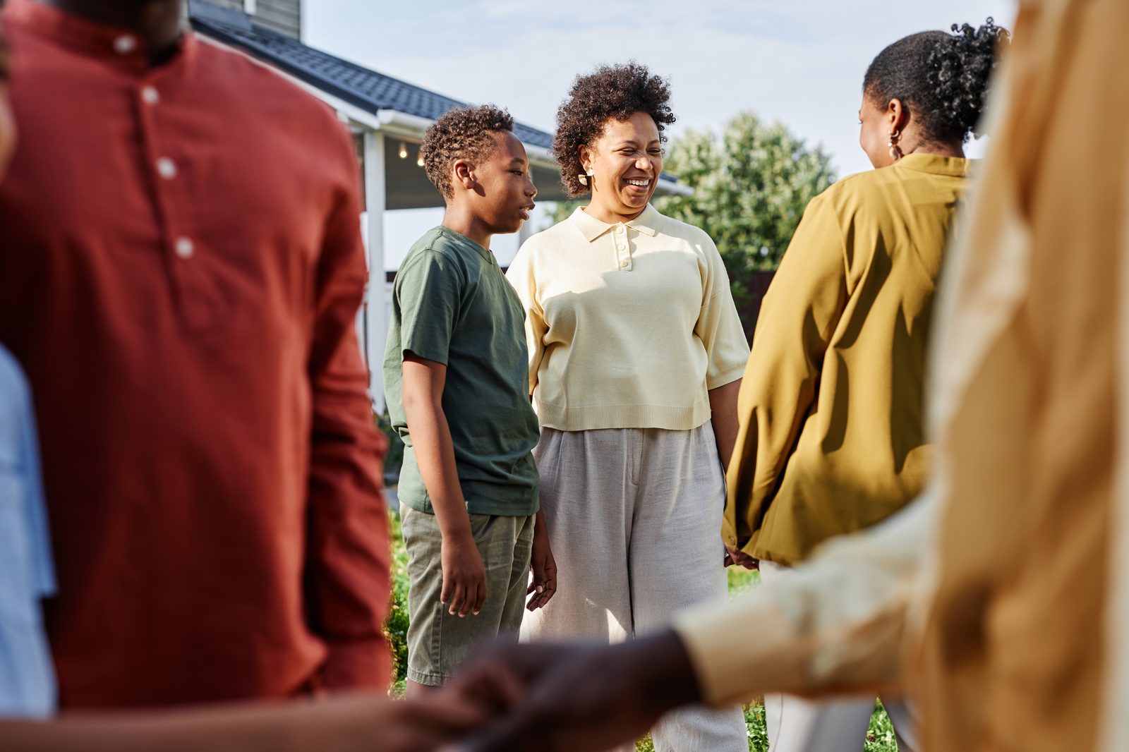 African American family and community members gathering outdoors at a nonprofit event